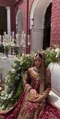 Maroon bridal lehenga with detailed dabka work and hand embroidery